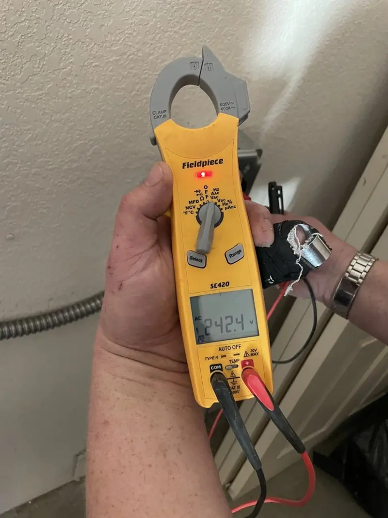 Voltage testing with clamp meter during Generator Installation in Castle Pines